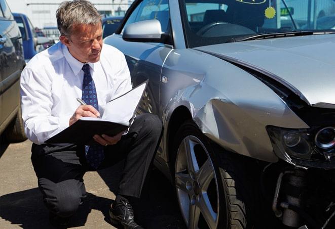 man discussing car insurance options with agent